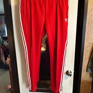 Adidas Red Sweatpants with Iconic Stripes
